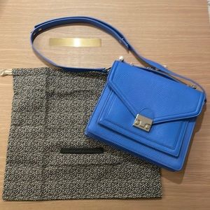 Brand new with tags Loeffler Randall Purse! Beautiful blue color.
